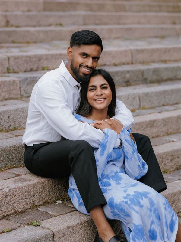 Engaged couple on stone steps