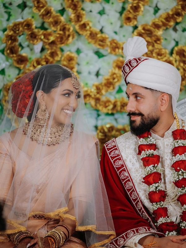 Bride and groom under the veil during the Hindu ceremony